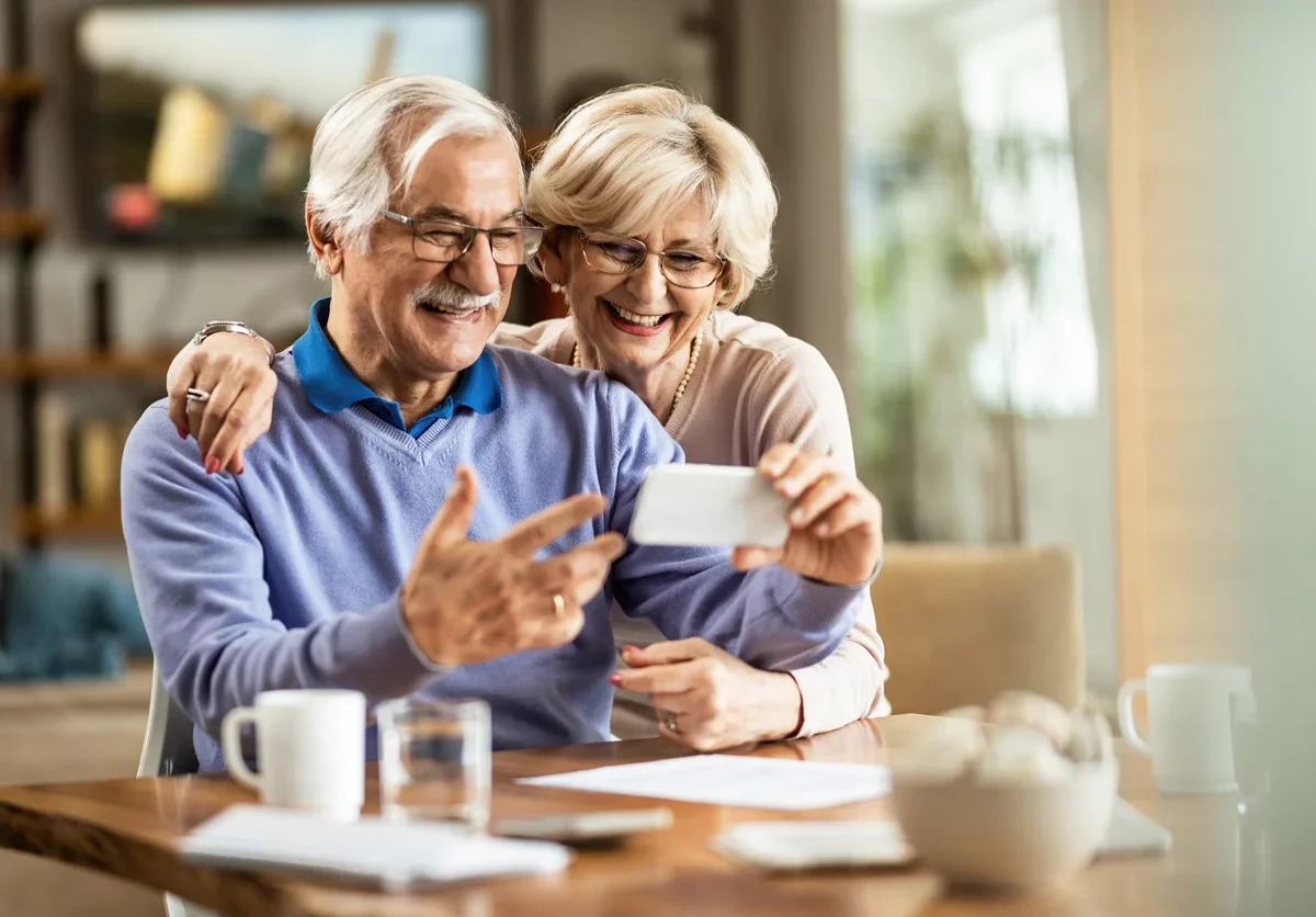 older couple enjoying looking at their phone