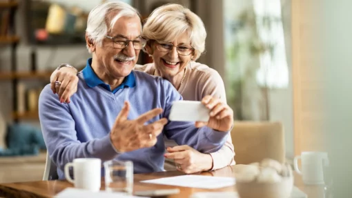 older couple enjoying looking at their phone