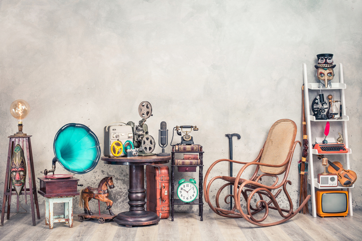 an image of antiques lined up against a wall