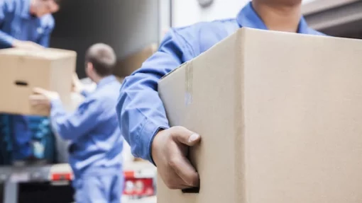 movers unloading a moving van