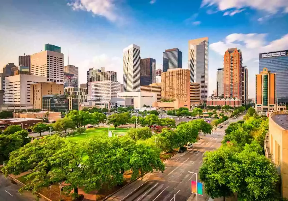 A photo overlooking a park with downtown Houston, TX, skyline behind it