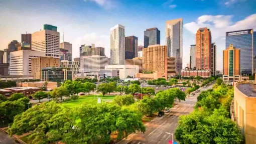 A photo overlooking a park with downtown Houston, TX, skyline behind it