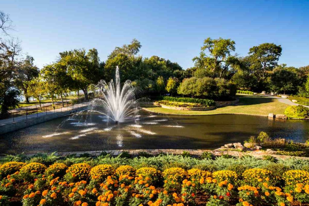 A view of the beautiful fountain in the Dallas Arboretum and Botanical Garden in autumn.