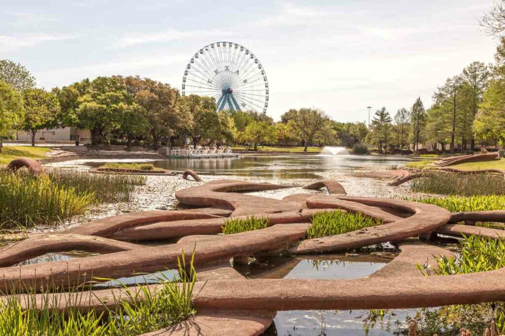 A view of Leonhardt Lagoon Nature Walk and the Ferris wheel in Fair Park, Dallas, TX.