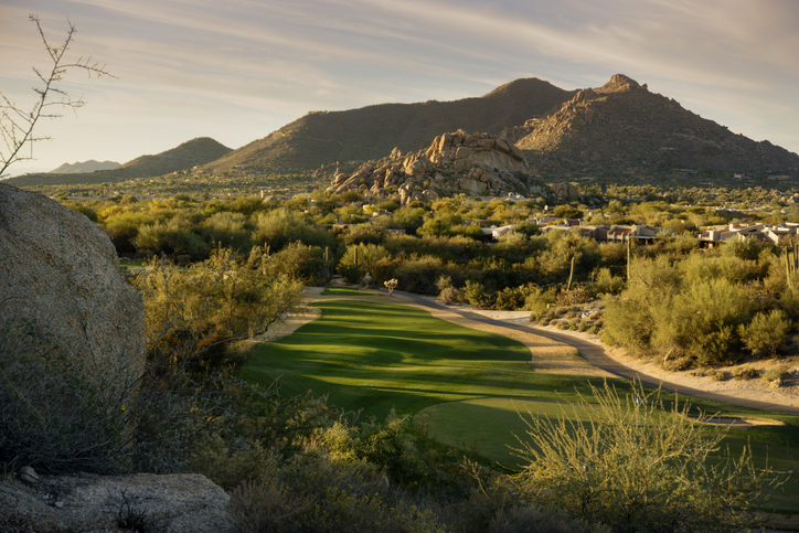 A golf course in the middle of a scenic landscape in Scottsdale, AZ.