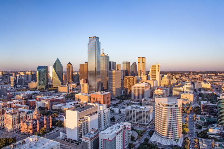 The skyline in downtown Dallas, TX, in the late afternoon on a clear day.