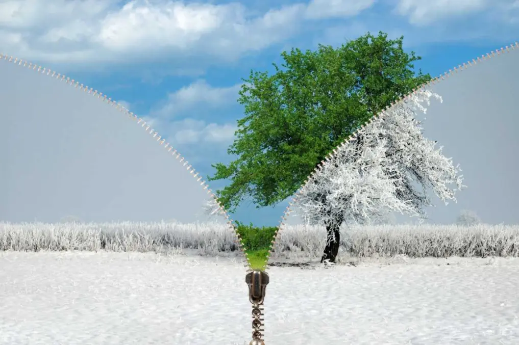 A zipper graphic divides a spring and winter landscape in half.